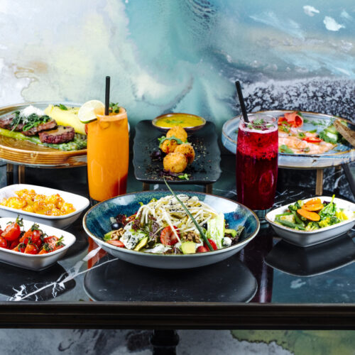 front view served table with cocktails